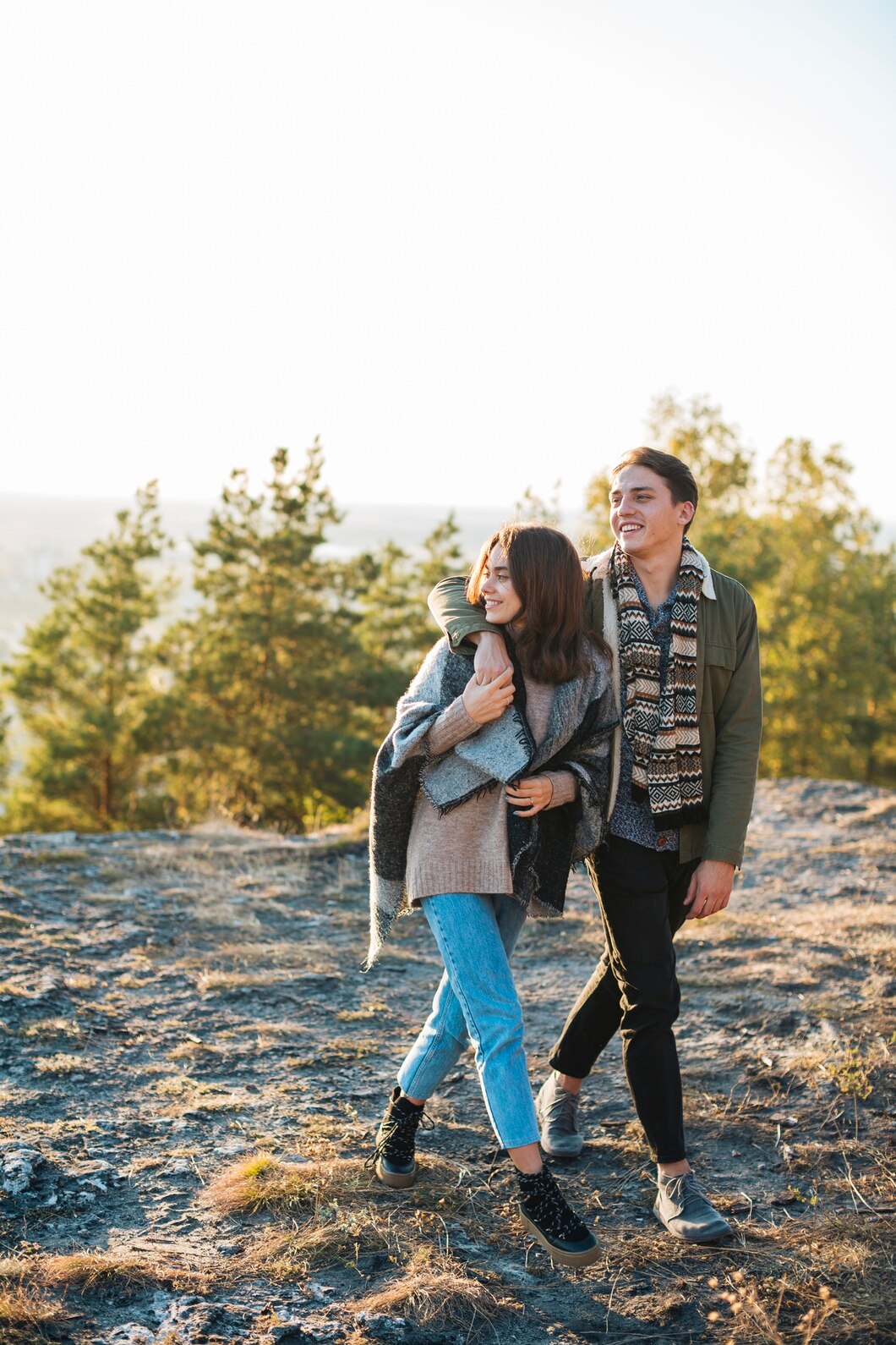 full-shot-young-couple-walking-park_23-2148316046